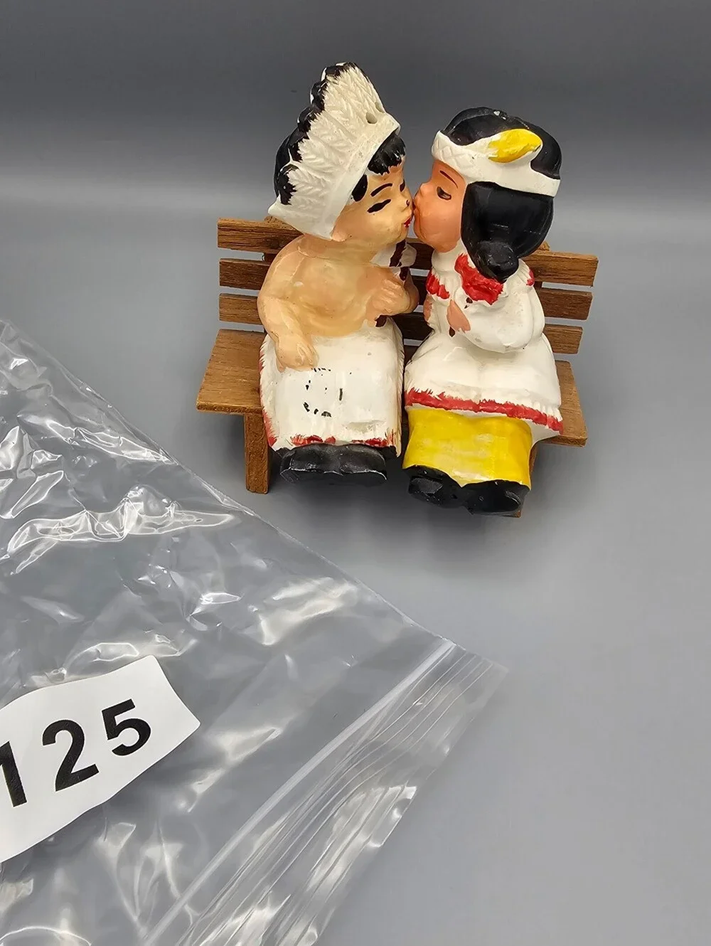 Vintage Ceramic Native American Couple Salt and Pepper Shakers on Wooden Bench